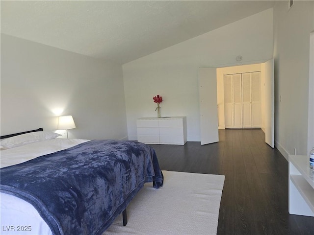 945 Vegas Valley Dr, Las Vegas, NV 89109 - bedroom with vaulted ceiling and wood finished floors