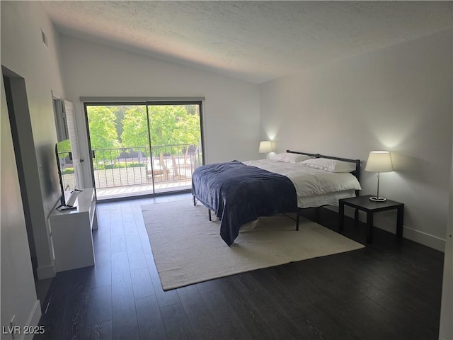 945 Vegas Valley Dr, Las Vegas, NV 89109 - bedroom with lofted ceiling, access to exterior, a textured ceiling, dark wood-style flooring, and baseboards