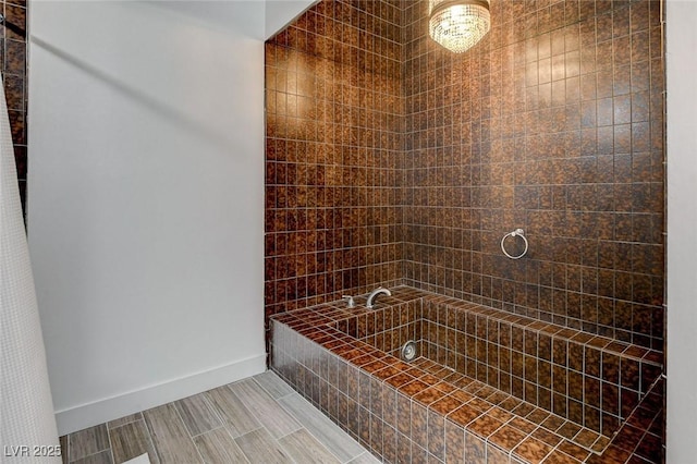 945 Vegas Valley Dr, Las Vegas, NV 89109 - bathroom featuring tiled bath and baseboards