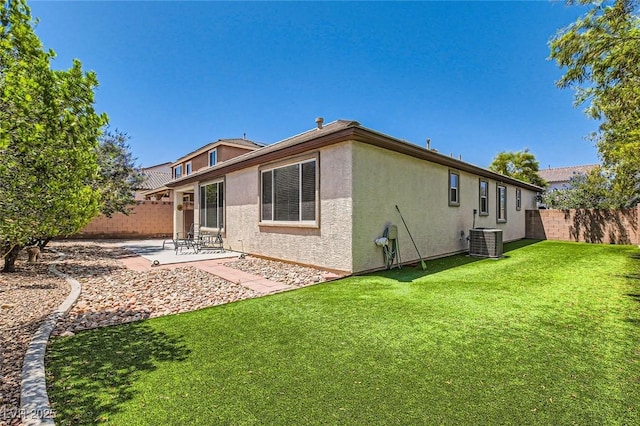 10121 Iron Wood Peak Ave, Las Vegas, NV 89166 - rear view of house with central AC unit, stucco siding, and a patio area