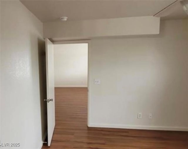 3125 N Buffalo Dr Unit 2104, Las Vegas, NV 89128 - unfurnished room with wood finished floors and baseboards