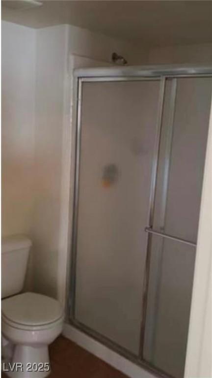 3125 N Buffalo Dr Unit 2104, Las Vegas, NV 89128 - bathroom featuring a shower stall and toilet