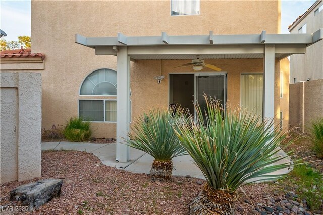 3331 Cheltenham St, Las Vegas, NV 89129 - doorway to property featuring ceiling fan, stucco siding, and a tiled roof
