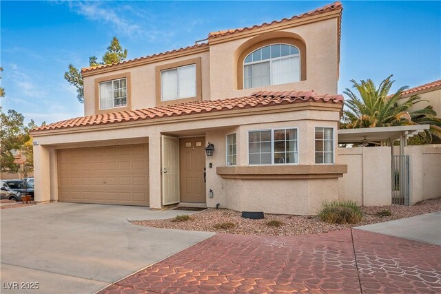 3331 Cheltenham St, Las Vegas, NV 89129 - mediterranean / spanish house featuring concrete driveway, stucco siding, a garage, and a tiled roof