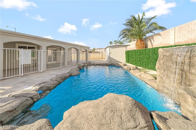 5453 Yvonne Cir, Las Vegas, NV 89122 - view of swimming pool with a fenced backyard, a shed, and a patio area
