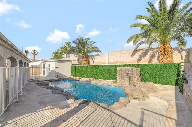 5453 Yvonne Cir, Las Vegas, NV 89122 - view of swimming pool featuring a fenced backyard, a patio, and an outdoor structure