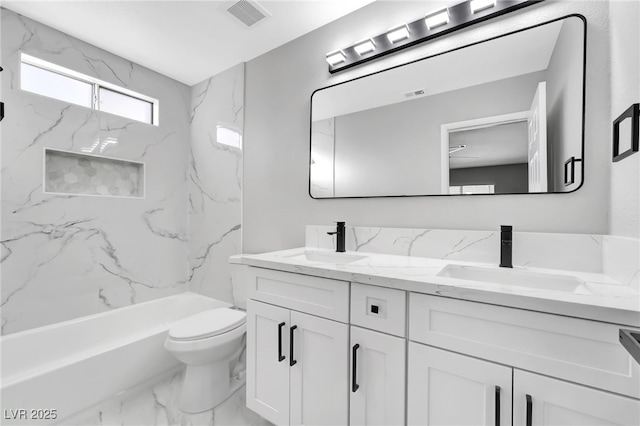 5453 Yvonne Cir, Las Vegas, NV 89122 - full bathroom featuring double vanity, marble look tile flooring, and shower / washtub combination