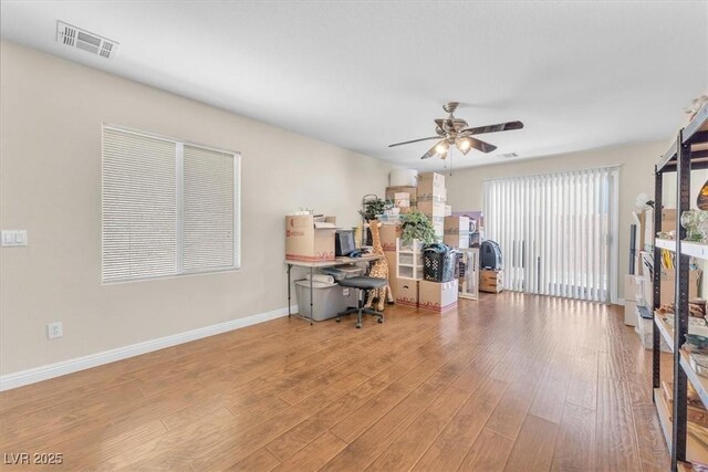 7852 Running Doe Ct, Las Vegas, NV 89149 - office space with wood finished floors, a ceiling fan, and baseboards