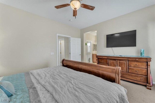7852 Running Doe Ct, Las Vegas, NV 89149 - carpeted bedroom featuring ensuite bathroom and ceiling fan