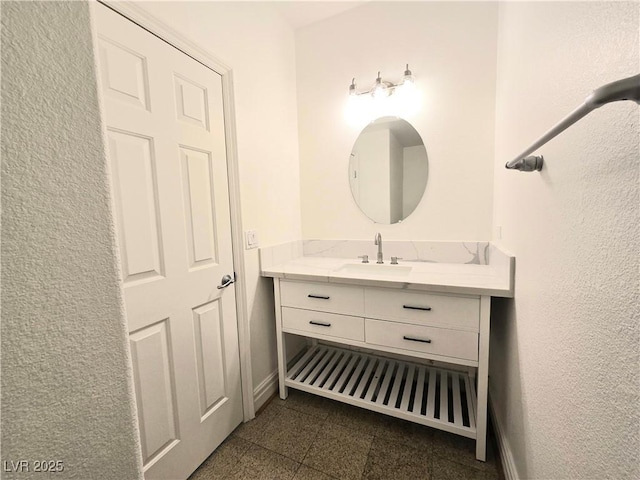 6638 Babys Tear Pl, Las Vegas, NV 89148 - bathroom with granite tiled floors, vanity, and baseboards