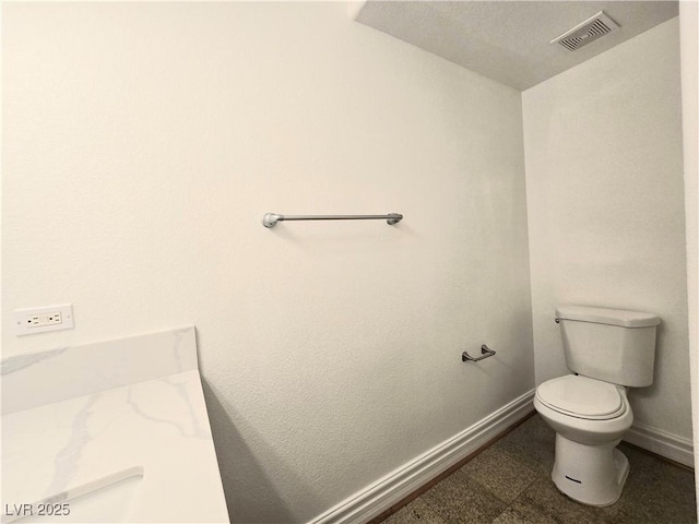 6638 Babys Tear Pl, Las Vegas, NV 89148 - bathroom featuring toilet and baseboards