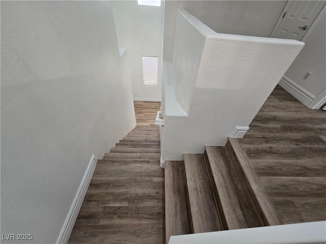 6638 Babys Tear Pl, Las Vegas, NV 89148 - staircase featuring wood finished floors and baseboards