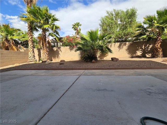 6638 Babys Tear Pl, Las Vegas, NV 89148 - fenced backyard with a patio