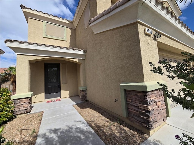 6638 Babys Tear Pl, Las Vegas, NV 89148 - entrance to property with stucco siding and a tiled roof