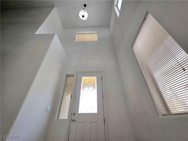 6638 Babys Tear Pl, Las Vegas, NV 89148 - doorway to outside with a high ceiling