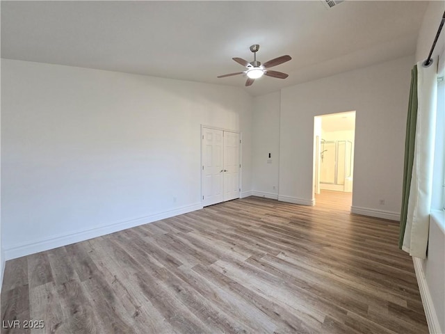 6638 Babys Tear Pl, Las Vegas, NV 89148 - unfurnished bedroom featuring wood finished floors, baseboards, a closet, and ceiling fan