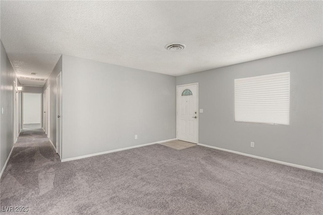 2432 Spanish Ct, Las Vegas, NV 89108 - unfurnished room with carpet flooring, a textured ceiling, and baseboards