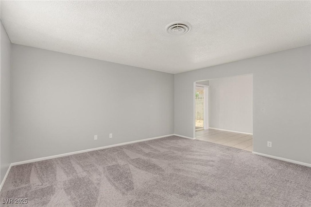 2432 Spanish Ct, Las Vegas, NV 89108 - carpeted spare room featuring a textured ceiling and baseboards