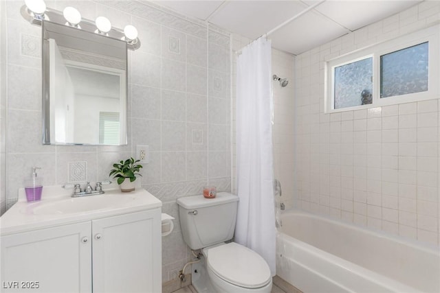 2432 Spanish Ct, Las Vegas, NV 89108 - full bathroom with tile walls, vanity, shower / bath combo, toilet, and tasteful backsplash