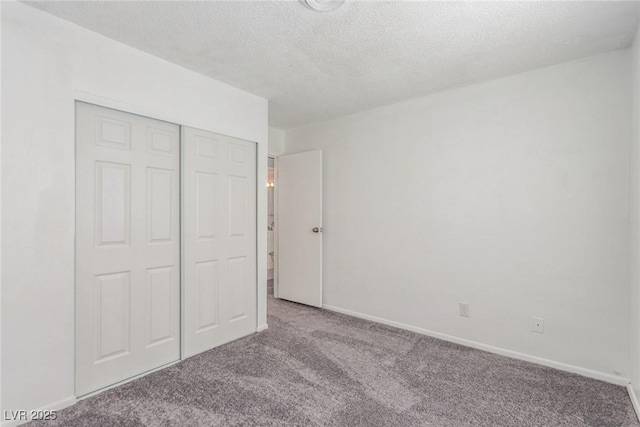 2432 Spanish Ct, Las Vegas, NV 89108 - unfurnished bedroom with carpet floors, a textured ceiling, a closet, and baseboards