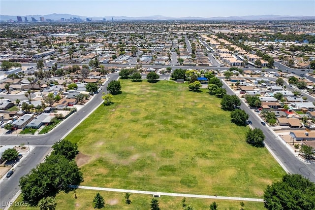 2432 Spanish Ct, Las Vegas, NV 89108 - aerial view of property's location featuring a mountainous background and nearby suburban area