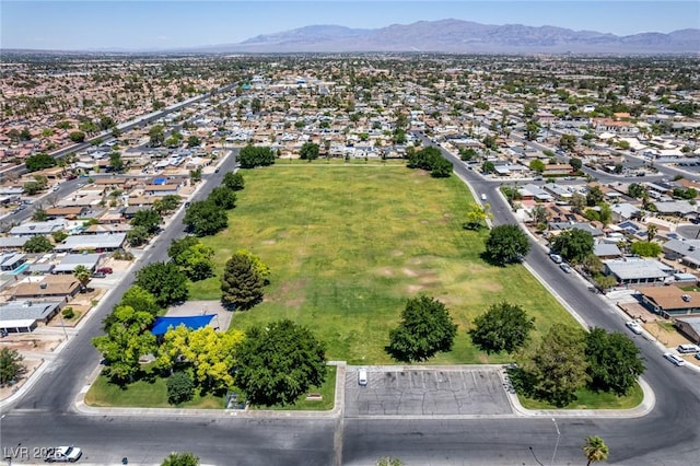 2432 Spanish Ct, Las Vegas, NV 89108 - aerial overview of property's location featuring a mountainous background and nearby suburban area
