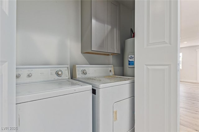 659 D Ave, Boulder City, NV 89005 - laundry room with washer and dryer, cabinet space, wood finished floors, and water heater