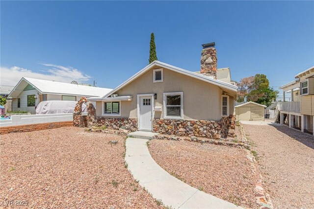 659 D Ave, Boulder City, NV 89005 - view of front facade featuring a chimney and stucco siding