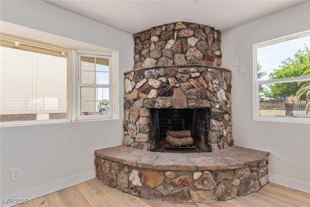 659 D Ave, Boulder City, NV 89005 - detailed view of baseboards, wood finished floors, and a fireplace