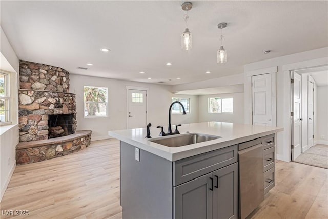 659 D Ave, Boulder City, NV 89005 - kitchen with a sink, stainless steel dishwasher, gray cabinetry, light wood-style floors, and open floor plan