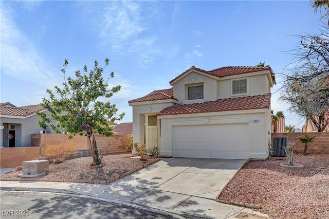 2573 Rafferty Creek Ln, Las Vegas, NV 89156 - mediterranean / spanish home featuring stucco siding, concrete driveway, a tiled roof, and a garage