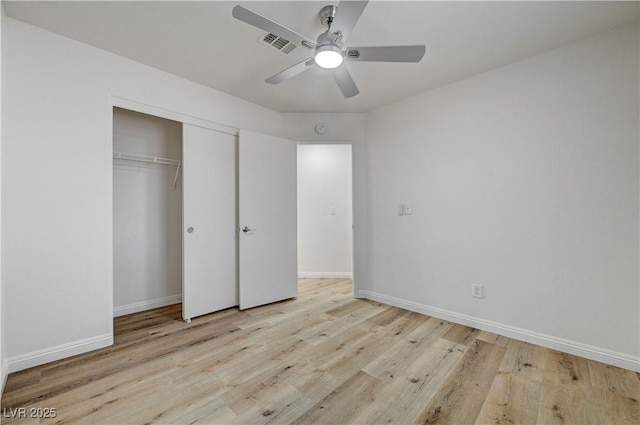 2573 Rafferty Creek Ln, Las Vegas, NV 89156 - unfurnished bedroom featuring wood finished floors, baseboards, a closet, and ceiling fan