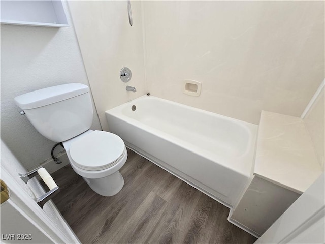 8545 Summer Vista Ave, Las Vegas, NV 89145 - bathroom featuring toilet, wood finished floors, and shower / washtub combination