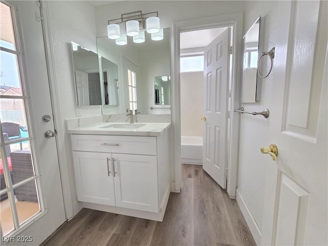 8545 Summer Vista Ave, Las Vegas, NV 89145 - bathroom with wood finished floors, vanity, and baseboards