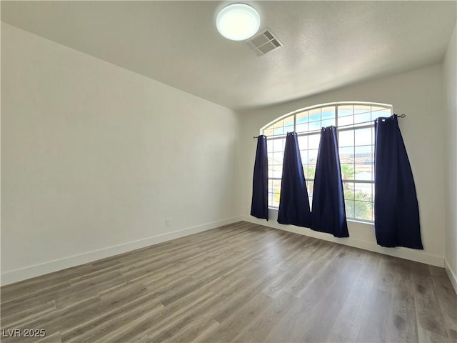 8545 Summer Vista Ave, Las Vegas, NV 89145 - unfurnished room featuring wood finished floors, baseboards, and a textured ceiling