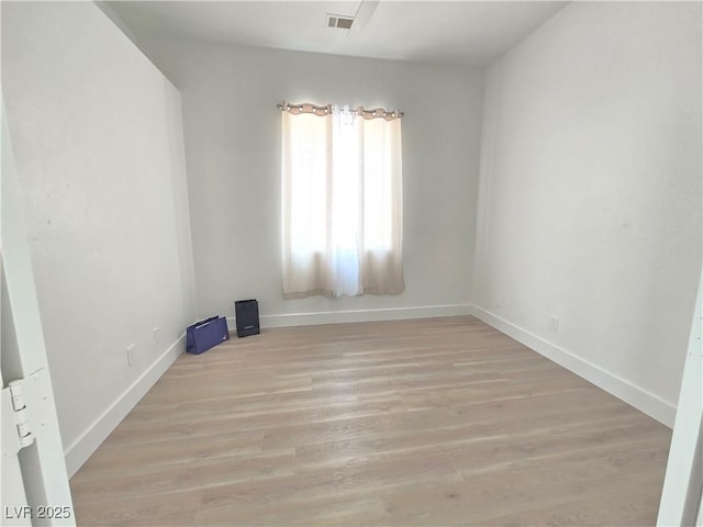 8545 Summer Vista Ave, Las Vegas, NV 89145 - unfurnished room featuring light wood-style floors and baseboards