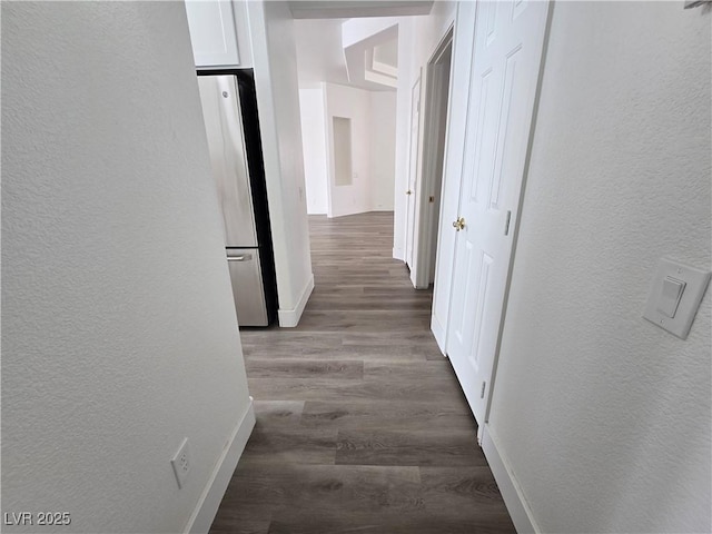 8545 Summer Vista Ave, Las Vegas, NV 89145 - hall featuring a textured wall, wood finished floors, and baseboards