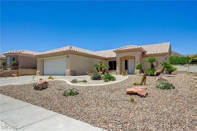 2545 Banora Point Dr, Las Vegas, NV 89134 - mediterranean / spanish-style home with stucco siding, a tiled roof, an attached garage, and concrete driveway