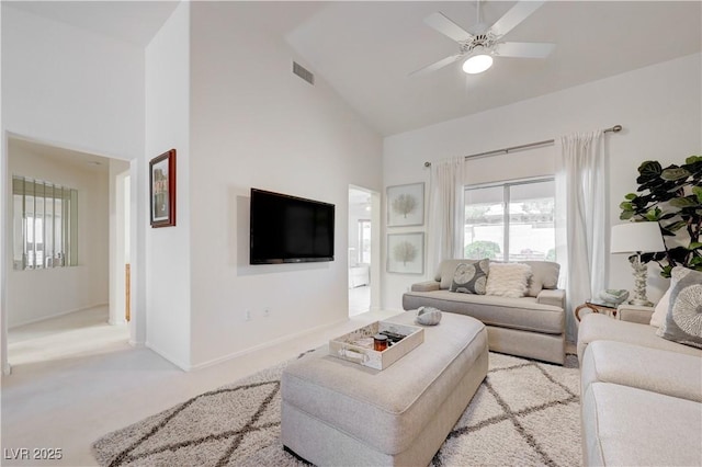 2545 Banora Point Dr, Las Vegas, NV 89134 - living room featuring high vaulted ceiling, ceiling fan, carpet floors, and baseboards