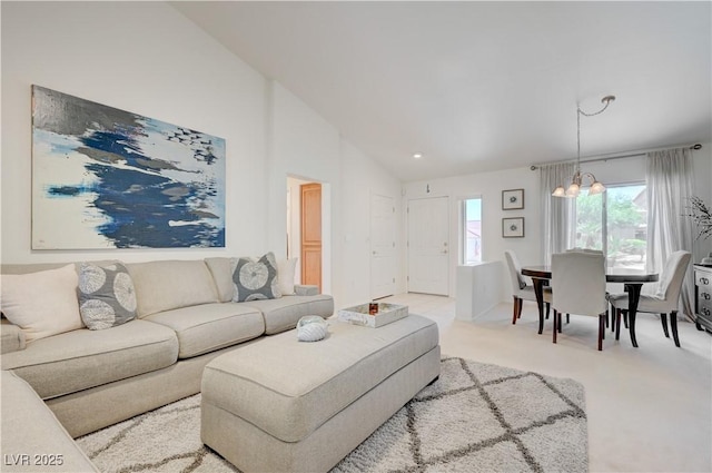 2545 Banora Point Dr, Las Vegas, NV 89134 - living area featuring lofted ceiling, light carpet, and a chandelier