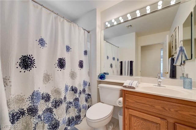 2545 Banora Point Dr, Las Vegas, NV 89134 - bathroom featuring toilet, vanity, and a shower with shower curtain