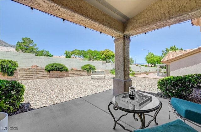 2545 Banora Point Dr, Las Vegas, NV 89134 - fenced backyard with a patio area