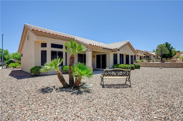 2545 Banora Point Dr, Las Vegas, NV 89134 - rear view of house with a tile roof and stucco siding