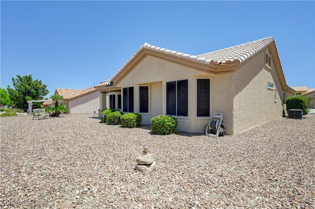 2545 Banora Point Dr, Las Vegas, NV 89134 - back of property with stucco siding, cooling unit, and a tile roof