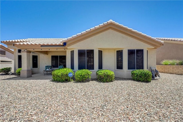 2545 Banora Point Dr, Las Vegas, NV 89134 - back of property with stucco siding, a tiled roof, and a patio area
