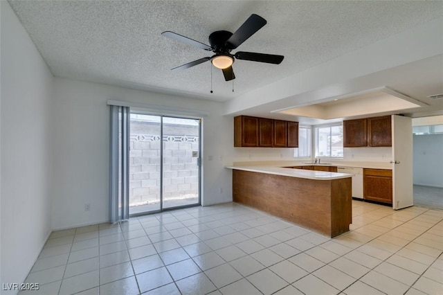 2116 Cameron St, Las Vegas, NV 89102 - kitchen with a sink, dishwasher, a peninsula, ceiling fan, and light countertops