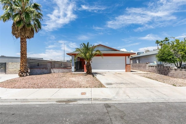 2116 Cameron St, Las Vegas, NV 89102 - ranch-style home with driveway, a garage, and brick siding
