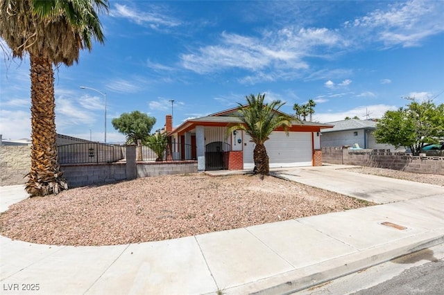 2116 Cameron St, Las Vegas, NV 89102 - view of front facade featuring driveway, brick siding, and a garage