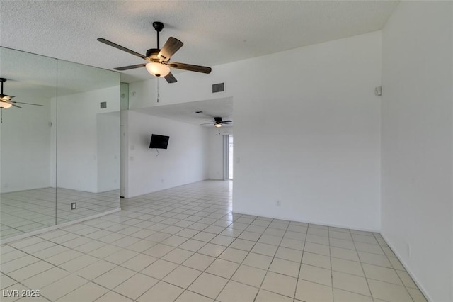 2116 Cameron St, Las Vegas, NV 89102 - spare room featuring ceiling fan, vaulted ceiling, and a textured ceiling