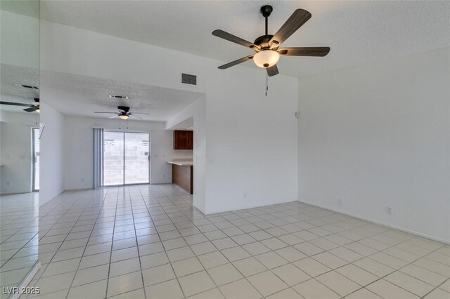 2116 Cameron St, Las Vegas, NV 89102 - empty room with a textured ceiling, a ceiling fan, and light tile patterned floors